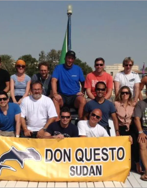 group picture of KAUS team on board Don Questo